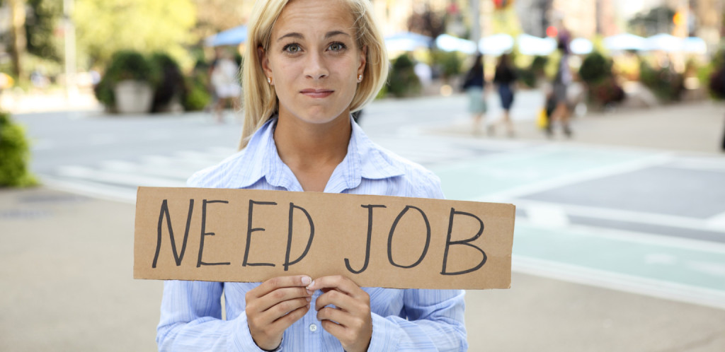 Woman Holds Employment Sign